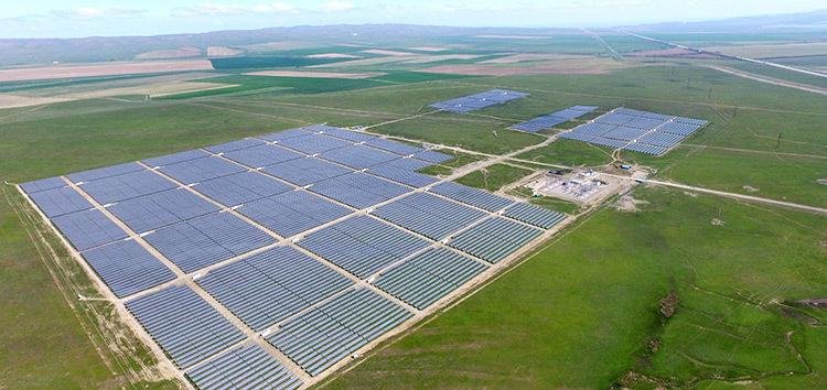 Aerial view of the Burnoye 2 50 MW solar plant in Kazakhstan surrounded by farmland